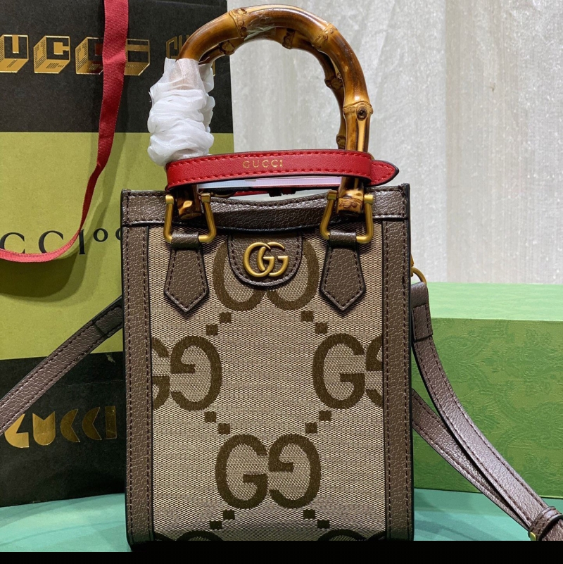 G*u*i top handle bags